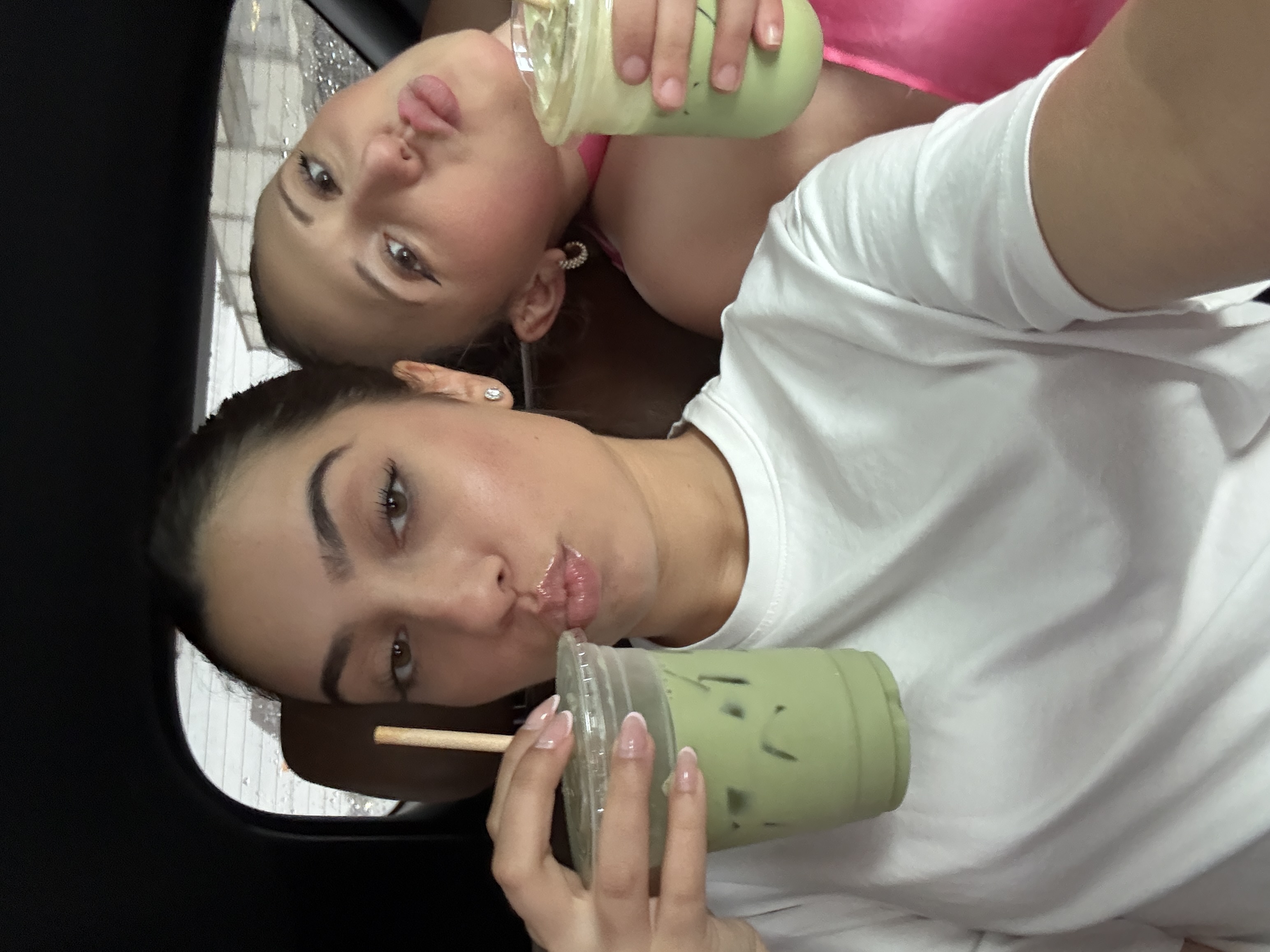 The Two Julias drinking iced matcha in Montreal